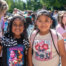 First day of school photo 2024. Two elementary students getting ready to go into the school.